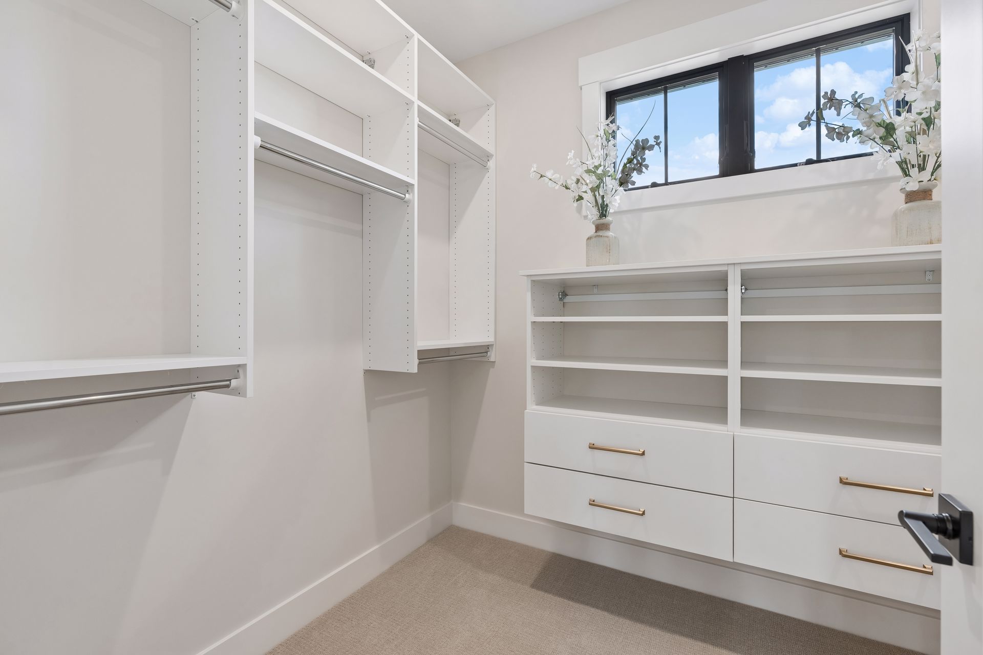 Custom walk-in closet with built-in shelving, drawers and organized storage